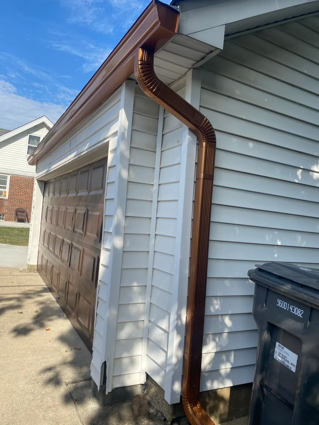 A luxury copper downspout installed on a home