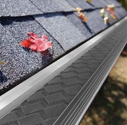 A quality gutter guard keeping leaves out of a clean gutter