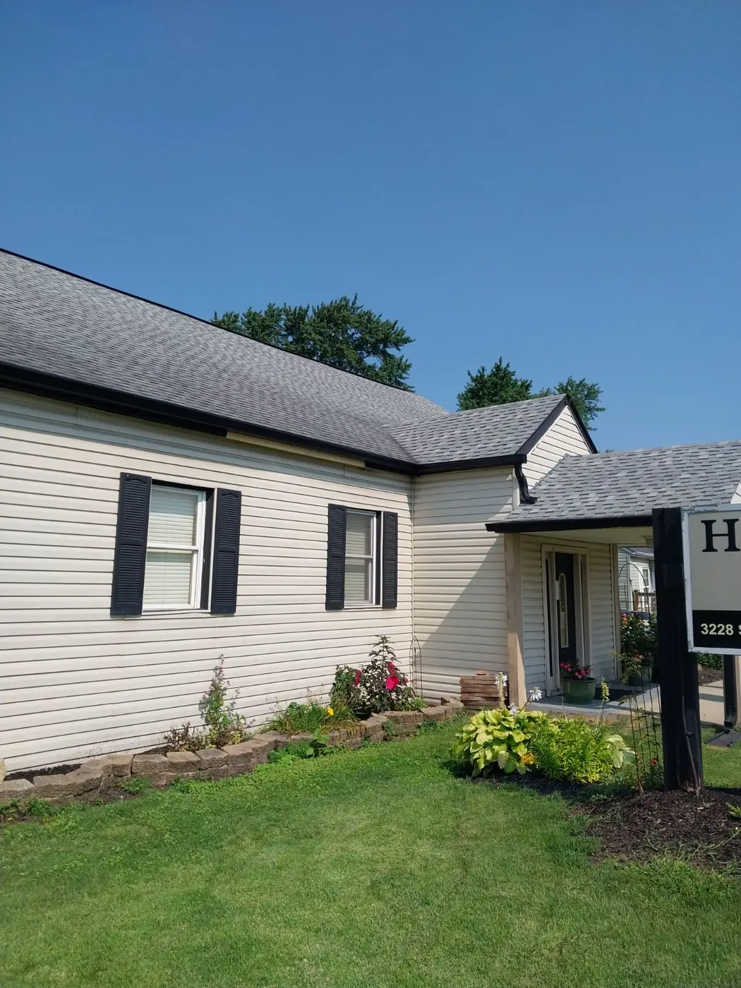 A finished home with new seamless gutters and fresh landscaping