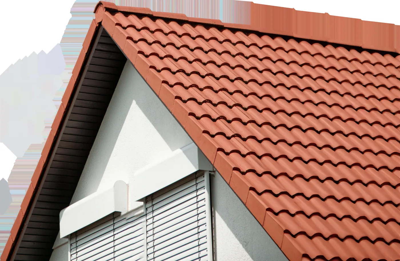 A clean tile roofline with new white gutters